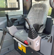 Yuchai Americas excavator operator cabin with control levers and seat