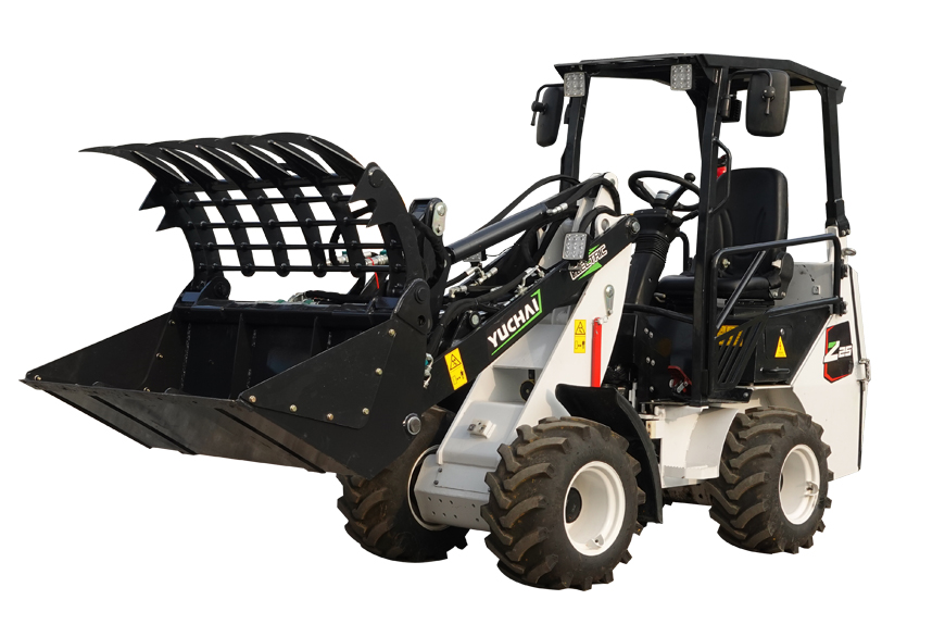 Yuchai Americas compact wheel loader with raised bucket and grapple attachment, showcasing its versatility for material handling